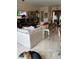 Spacious living room featuring comfortable seating, tiled floors, and natural light at 6061 Gulf Of Mexico Dr, Longboat Key, FL 34228
