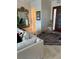 Cozy living room with plush sofa, patterned rug, and decorative front entry at 6061 Gulf Of Mexico Dr, Longboat Key, FL 34228