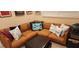 Cozy living room featuring a plush sectional sofa with decorative pillows at 6061 Gulf Of Mexico Dr, Longboat Key, FL 34228