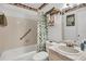 Clean bathroom with shower/tub combo and vanity at 6064 Arlene Way, Bradenton, FL 34207