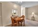 Bright dining area with round table and four chairs, offering a cozy space for meals at 6064 Arlene Way, Bradenton, FL 34207