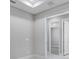 Neutral bedroom with tray ceiling, white trim, and door to the en suite bathroom at 6107 Mesa Gln, Bradenton, FL 34203