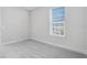 Bedroom features carpet flooring, window with blinds and neutral wall paint at 6107 Mesa Gln, Bradenton, FL 34203
