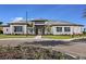 Attractive single-story home with a well-manicured lawn, paved driveway, and contemporary architectural details at 6107 Mesa Gln, Bradenton, FL 34203