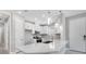 Bright kitchen with a spacious island, stainless steel appliances, and stylish pendant lighting at 6107 Mesa Gln, Bradenton, FL 34203