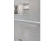 Bright living room features tile flooring and an open floor plan to the kitchen at 6107 Mesa Gln, Bradenton, FL 34203