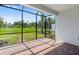 Relax on this screened patio with brick flooring and a beautiful view of the expansive backyard at 6107 Mesa Gln, Bradenton, FL 34203