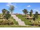 Picturesque walking path featuring stone steps, lush greenery, and panoramic views, ideal for outdoor exercise at 6107 Mesa Gln, Bradenton, FL 34203