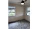 Empty bedroom with gray walls, new flooring, and window blinds at 6504 Lincoln Rd, Bradenton, FL 34203