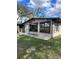 Tan house with large windows and grassy yard at 6504 Lincoln Rd, Bradenton, FL 34203