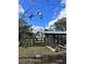 Home showcasing side yard and wooden fence at 6504 Lincoln Rd, Bradenton, FL 34203