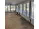 Bright Florida room with multiple windows and shutters at 6504 Lincoln Rd, Bradenton, FL 34203