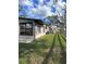 Side of house with large windows and grassy yard at 6504 Lincoln Rd, Bradenton, FL 34203
