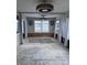 Unfinished living room with window and exposed walls at 6504 Lincoln Rd, Bradenton, FL 34203