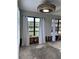 Unfinished living room with large windows and exposed walls at 6504 Lincoln Rd, Bradenton, FL 34203