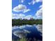 Stunning water view with lush greenery and a reflective surface at 6504 Lincoln Rd, Bradenton, FL 34203