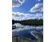 Serene waterfront view featuring a calm body of water and lush vegetation at 6504 Lincoln Rd, Bradenton, FL 34203