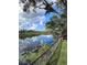 Peaceful waterfront view with a wooden fence and calm water at 6504 Lincoln Rd, Bradenton, FL 34203