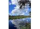 Tranquil waterfront property showcasing a calm river and lush vegetation at 6504 Lincoln Rd, Bradenton, FL 34203