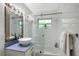 Bright bathroom features walk-in shower, modern lighting, and updated vanity at 730 40Th St, Sarasota, FL 34234
