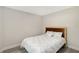 Simply decorated bedroom with wood accented headboard and bright natural light at 730 40Th St, Sarasota, FL 34234