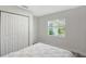 Cozy bedroom featuring a large closet, bright window, and modern fixtures at 730 40Th St, Sarasota, FL 34234