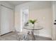 Small dining area with table and chairs adjacent to bedroom and closet at 730 40Th St, Sarasota, FL 34234