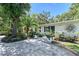 Charming front entrance with green shutters, paver walkway, and well-maintained landscaping at 730 40Th St, Sarasota, FL 34234