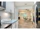 Open concept kitchen featuring stainless steel appliances and an adjacent dining area at 730 40Th St, Sarasota, FL 34234