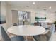 Open concept living room with a view of the kitchen and dining area in a modern home at 730 40Th St, Sarasota, FL 34234