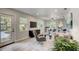 Bright living room and dining area with modern furnishings, hardwood floors, and lots of natural light at 730 40Th St, Sarasota, FL 34234