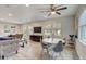 Open-concept living and dining area featuring modern furniture, ample seating, and a ceiling fan for comfort at 730 40Th St, Sarasota, FL 34234