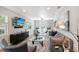 Inviting living area featuring modern decor, a sleek entertainment center, and comfortable seating for relaxing at 730 40Th St, Sarasota, FL 34234