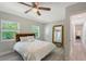 Bright main bedroom with a large mirror and big windows overlooking the yard at 730 40Th St, Sarasota, FL 34234