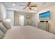 Cozy main bedroom with ceiling fan, television, and small dining table and chairs at 730 40Th St, Sarasota, FL 34234