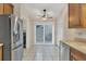 Bright kitchen with stainless steel appliances and wood cabinets at 4882 Tivoli Ave, Sarasota, FL 34235