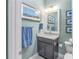 Updated bathroom with granite countertop, modern vanity, and decorative tile at 10732 Klee Ave, Bradenton, FL 34212