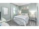 Guest bedroom with window, neutral decor, and a bedside table at 10732 Klee Ave, Bradenton, FL 34212