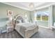 Spacious bedroom with large window, soft carpet, and neutral decor at 10732 Klee Ave, Bradenton, FL 34212