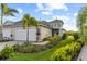 Two-car garage villa with lush landscaping at 10732 Klee Ave, Bradenton, FL 34212