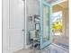 Inviting front entry featuring a light teal door and sidelights at 10732 Klee Ave, Bradenton, FL 34212