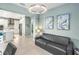 Bright living room features a comfortable couch and view into the kitchen at 10732 Klee Ave, Bradenton, FL 34212