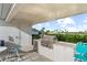 Community outdoor grill area with ample counter space and seating at 10732 Klee Ave, Bradenton, FL 34212