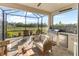 Enjoy grilling and entertaining in this screened patio with an outdoor kitchen at 10732 Klee Ave, Bradenton, FL 34212