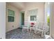 Front porch with rocking chairs and a peaceful setting at 10732 Klee Ave, Bradenton, FL 34212