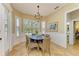 Bright breakfast nook with round table and wicker chairs at 14019 18Th E Pl, Bradenton, FL 34212