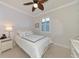 Guest bedroom with a queen bed and ceiling fan at 19864 Petrino St, Venice, FL 34293