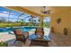 Covered patio overlooking the pool, perfect for relaxing at 19864 Petrino St, Venice, FL 34293