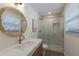 Modern bathroom with a large walk-in shower and a sleek vanity at 213 83Rd St # East, Holmes Beach, FL 34217