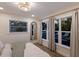 Bedroom with window views of the pool and a large, comfortable bed at 213 83Rd St # East, Holmes Beach, FL 34217
